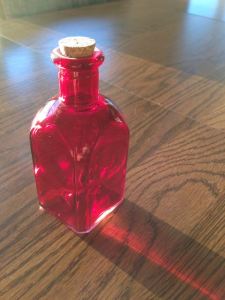 Red glass bottle